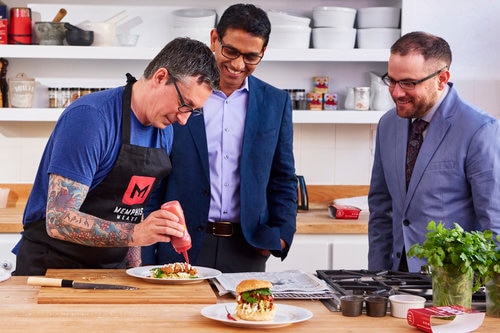 Dr Uma Valetti with Co-founder Nicholas Genovese and a chef plating up laboratory manufactured meat.