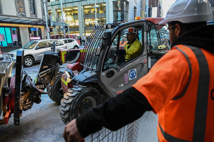 A construction truck on the footpath.