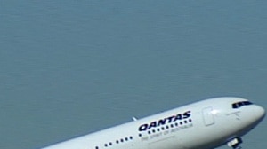 Qantas has achieved a half-year profit of close to half a billion dollars.