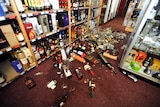 Bottles litter floor of bottle shop after NZ earthquake