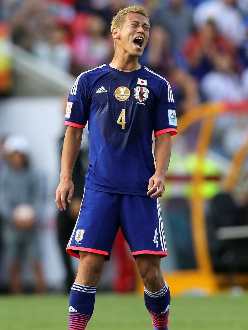 Less than impressed ... Keisuke Honda shows his frustration against Palestine