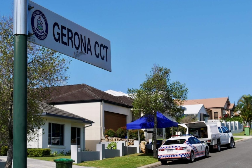 A street, Gerona Circuit, with police cars in the background.