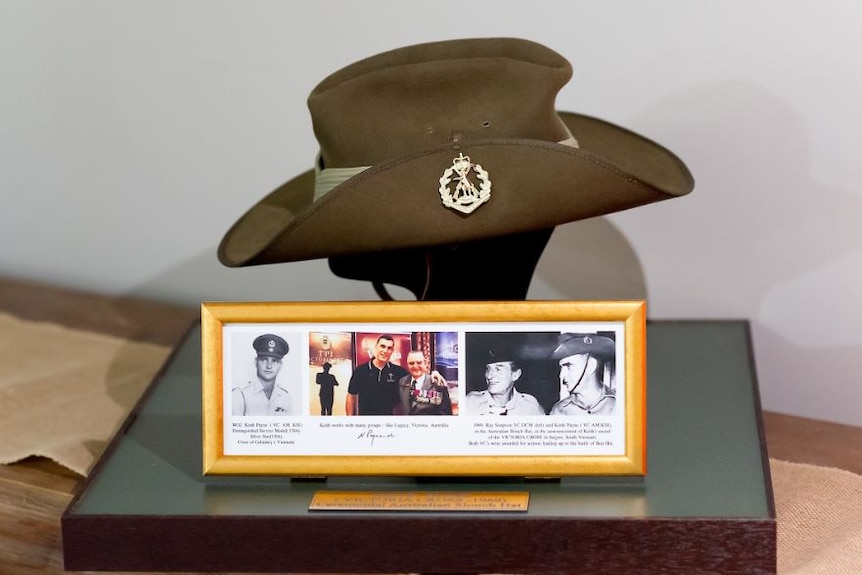 Australian army green hat with photos of the VC on display