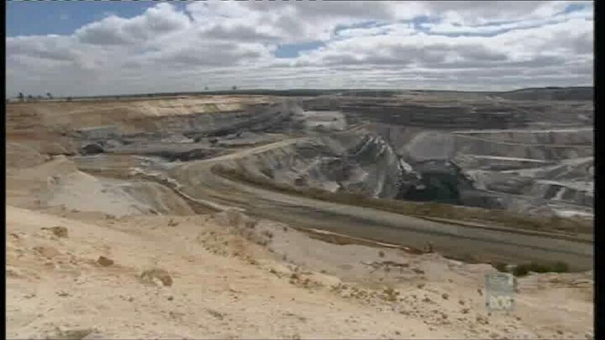 Wide photograph looking over a coal mine.
