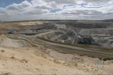 Wide photograph looking over a coal mine.