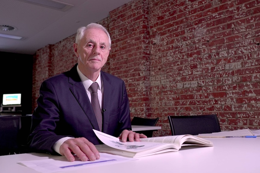 Portrait photo of public health expert Professor John Glover.