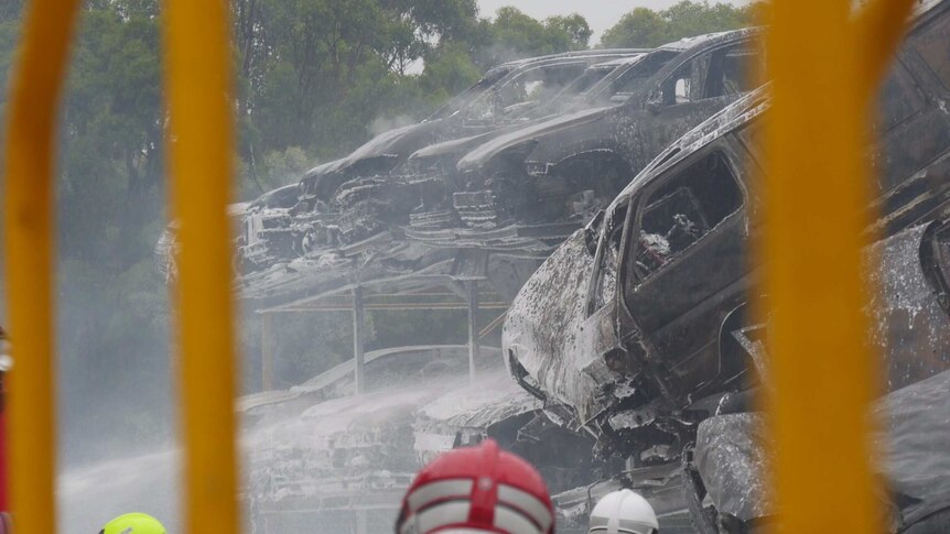 A huge fire at a car yard in Sydney's south west has caused a smoke haze for kilometres