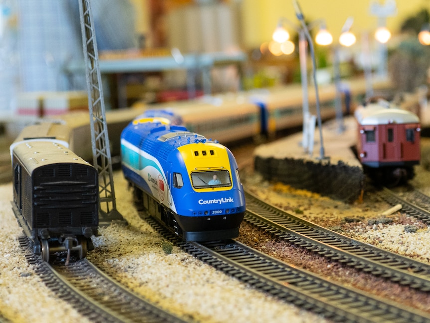 A miniature Countrylink XPT train on a model railway set.
