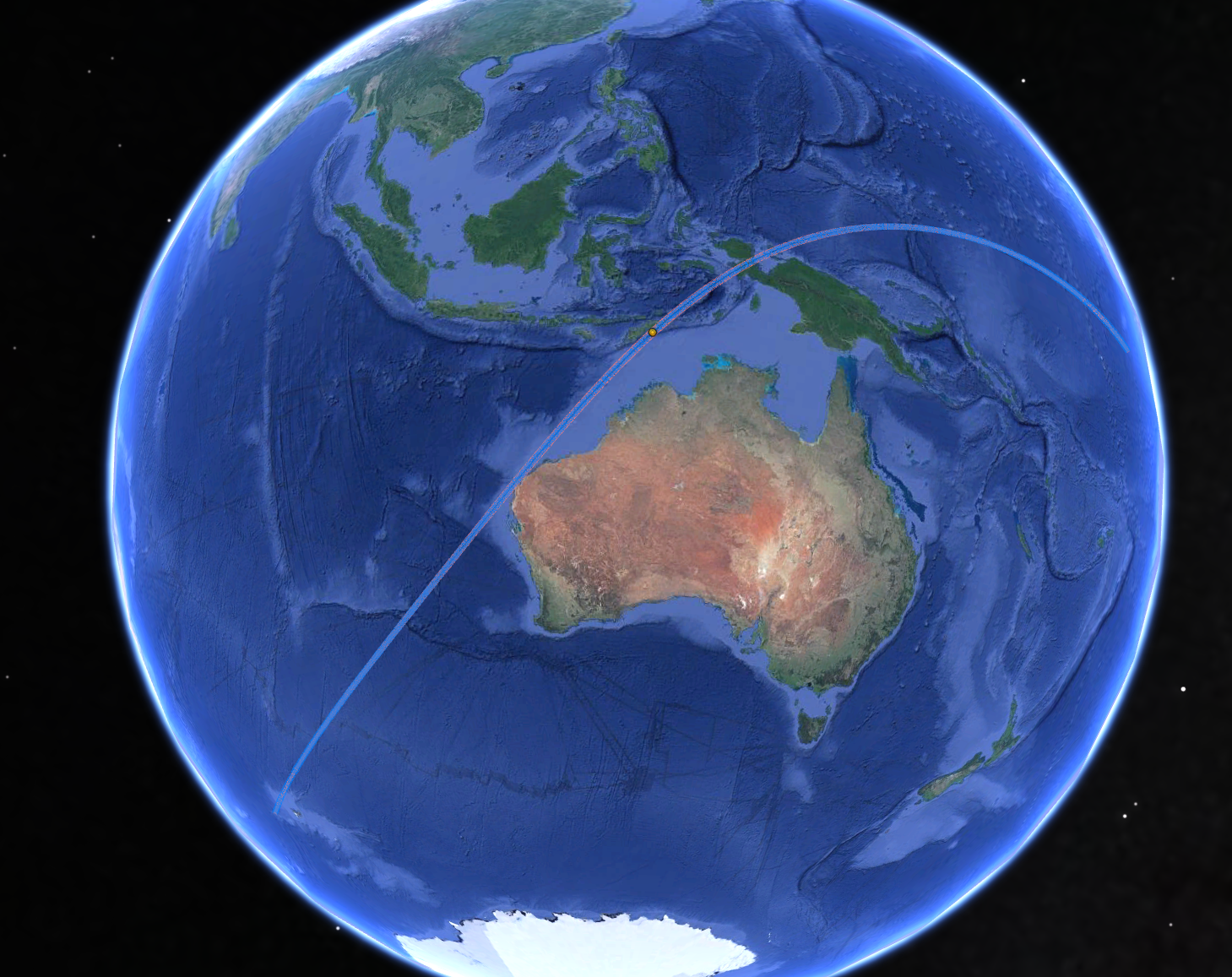 A view of Australia from space, showing a curving line brushing the north-west coast.  