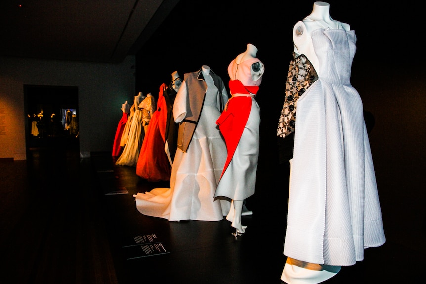 Row of hand stitched gowns at Bendigo Art Gallery