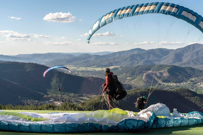 Paragliders take off