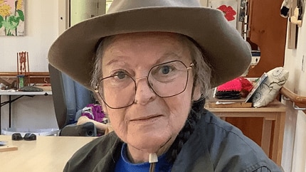elderly woman wearing hat