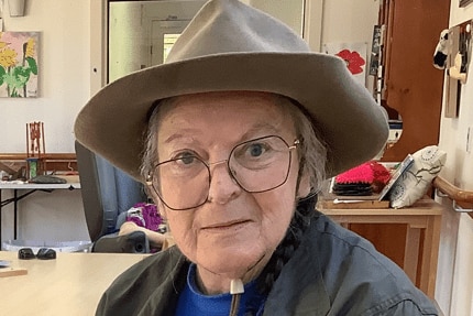 elderly woman wearing hat
