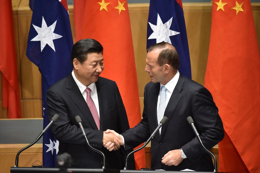 Xi Jinping shakes hands with Prime Minister Tony Abbott 