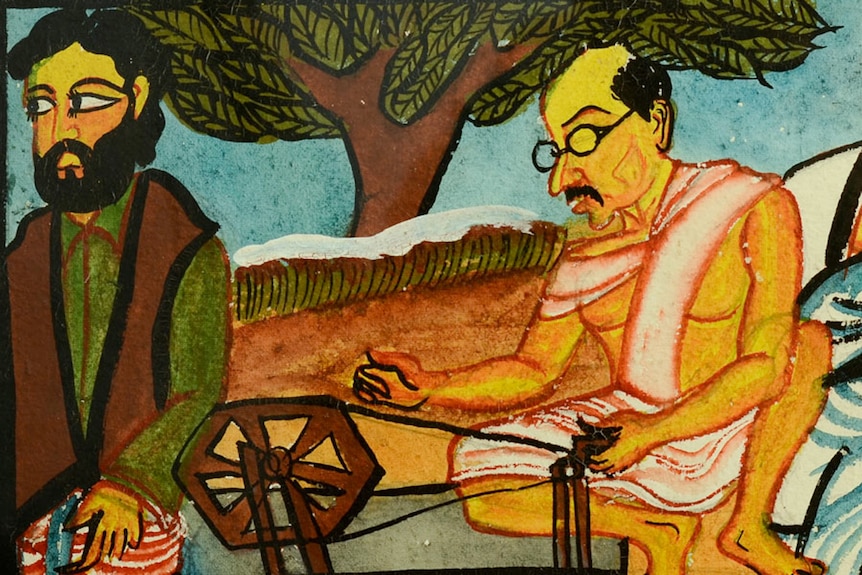 Painting of a Gandhi spinning cotton.