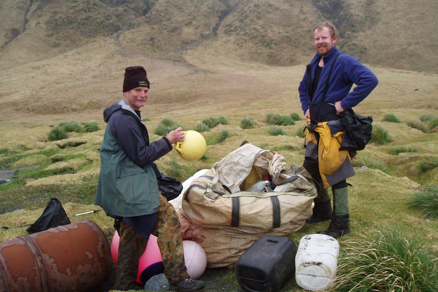 Macquarie Island staff Ivor Harris and Mike Fawcett with some of the debris collected in a clean up.