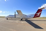 The QantasLink plane on the tarmack at Broken Hill airport.  