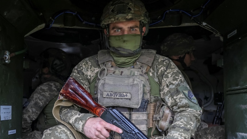 Army soldier holding a gun