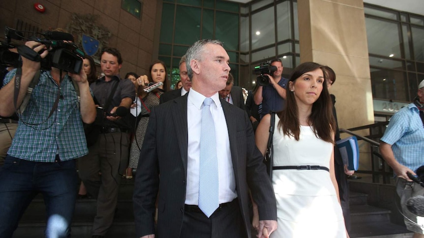 Craig Thomson leaves the Melbourne Magistrate Court with his wife Zoe Arnold.