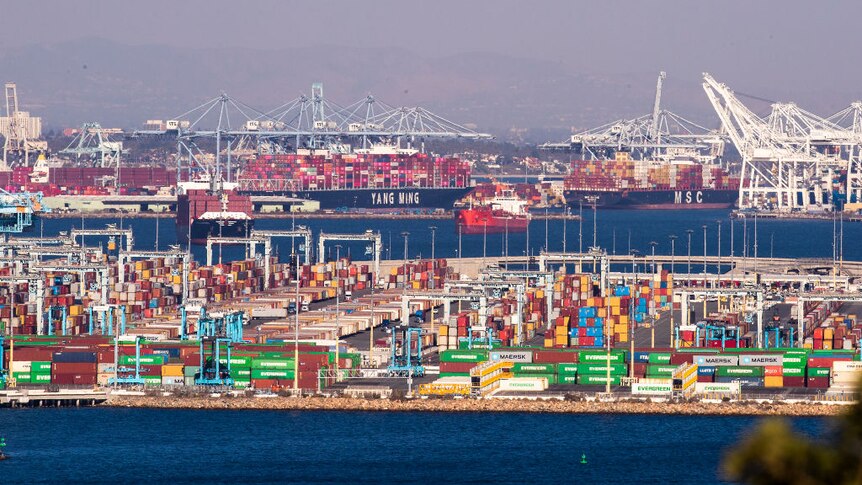 Thousands of containers sit, waiting to be loaded as large container ships are unloaded from the Ports of Los Angeles and Long Beach.