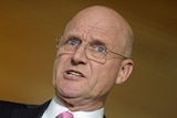 David Leyonhjelm gestures with his hand while talking.