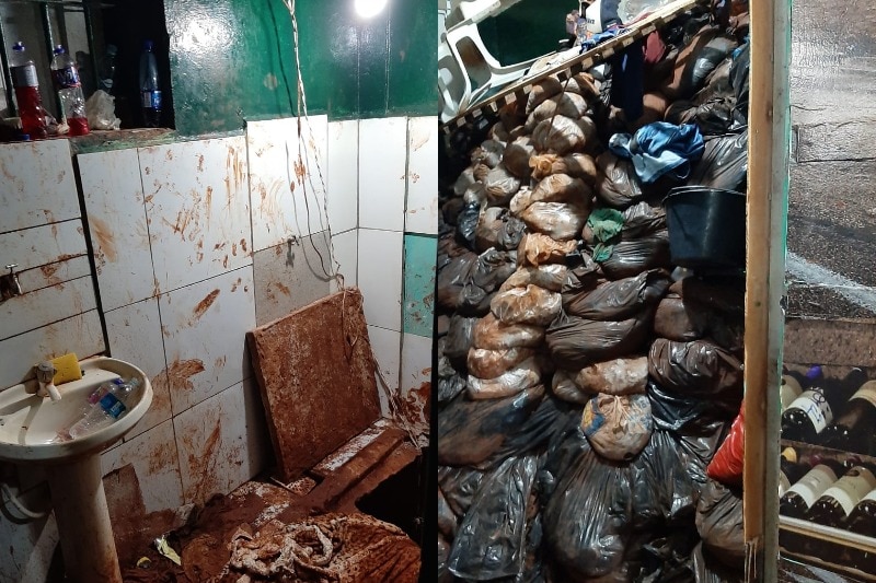 You view two images of the interior of a dirty jail cell, one with its tiles ripped up and muddy handprints on the remainder.