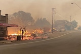 stores burning on a main regional town