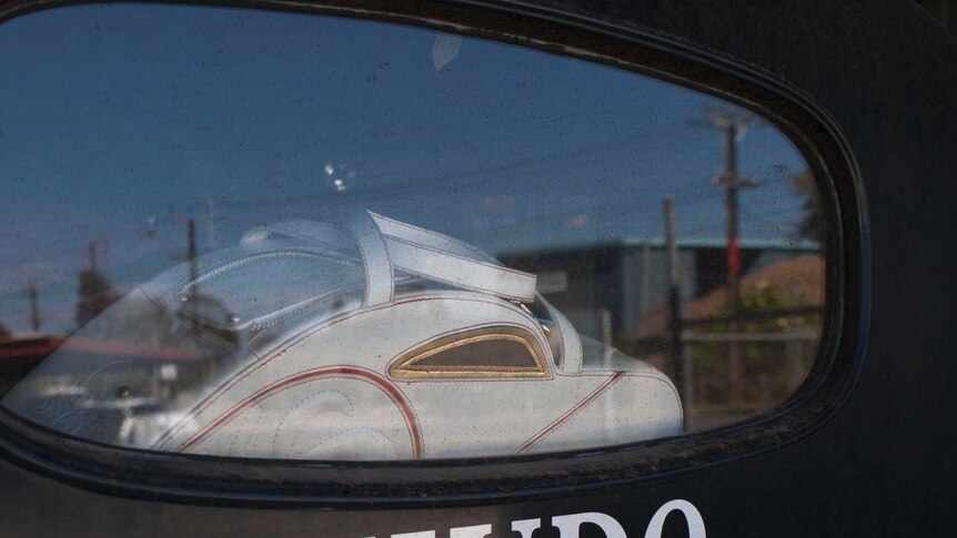Ms Hetzer's love of automotive handbags is visible through the rear window.