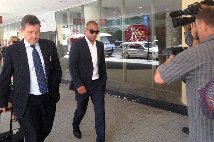 Former AFL player Daniel Kerr leaves a Perth court with lawyer John Prior in November 2014.