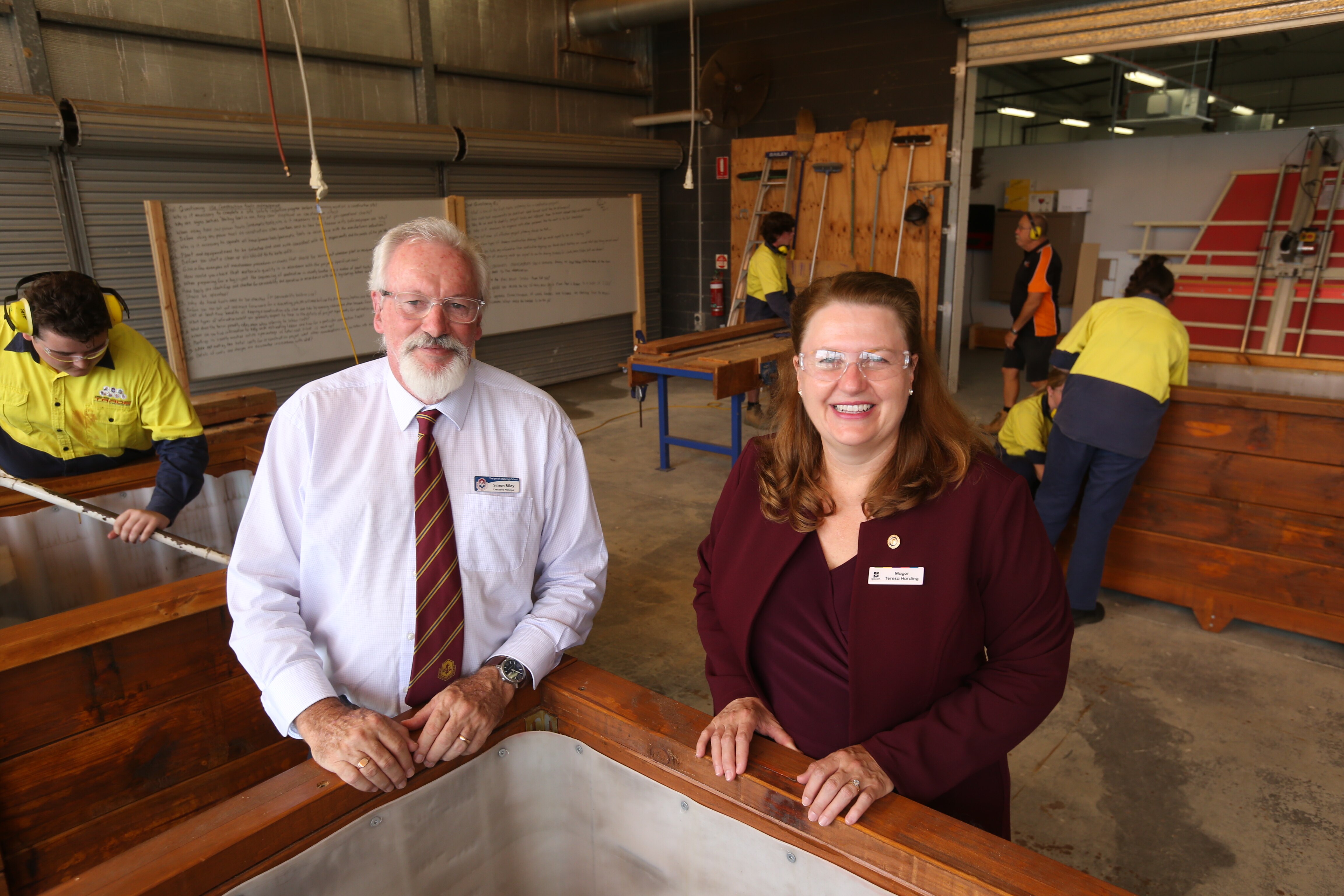 Principal and mayor smile