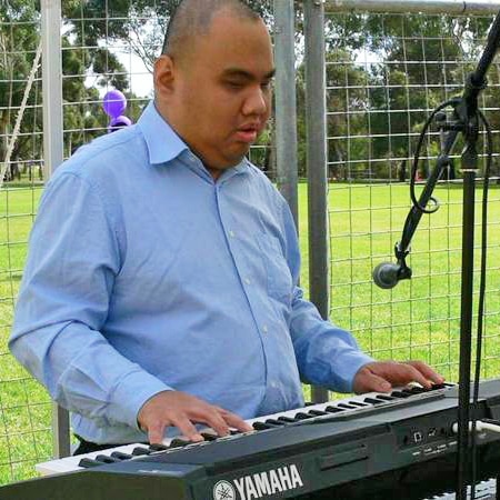 David Lee plays a keyboard.