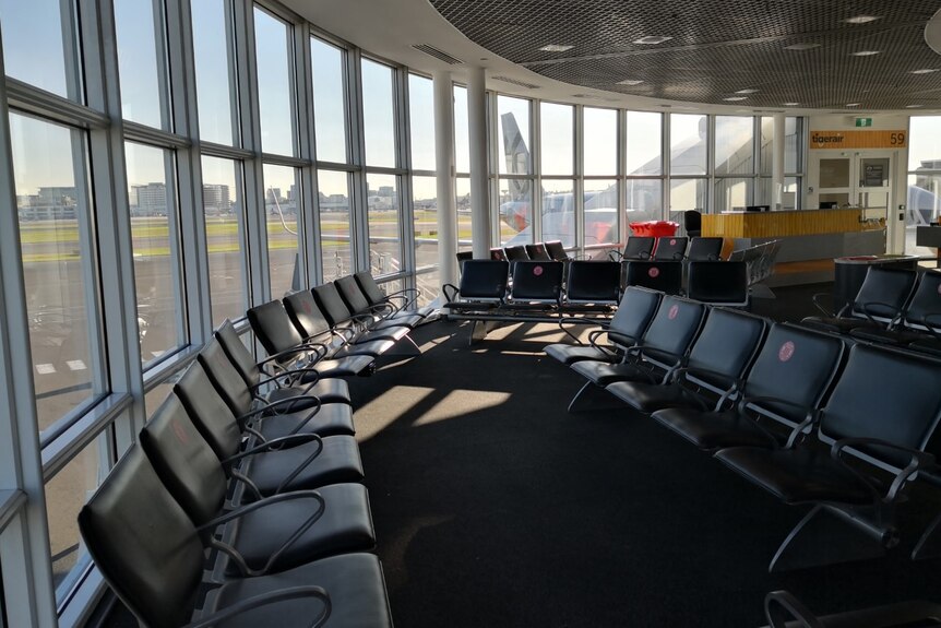 Photo of empty chairs at Sydney's airport.