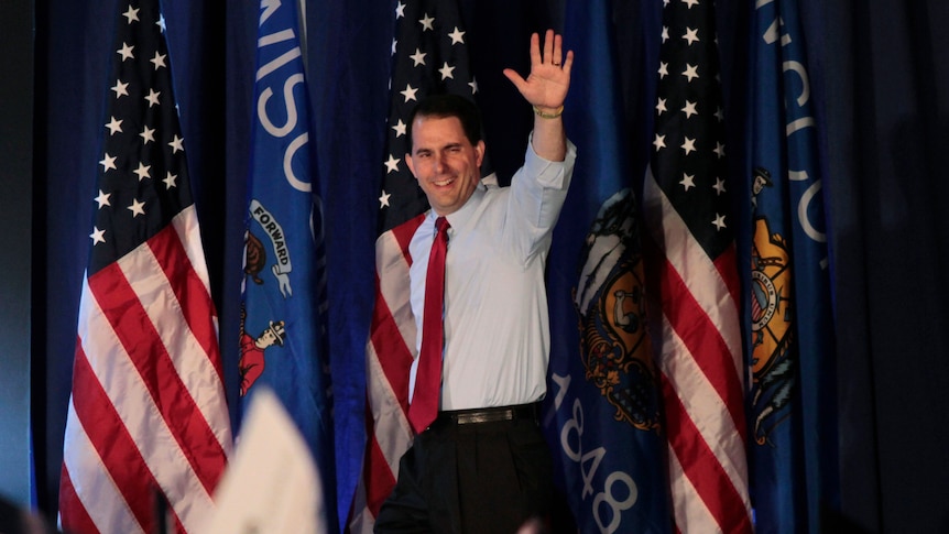 Republican Governor Scott Walker celebrates victory in the recall election against Milwaukee Mayor Tom Barrett.