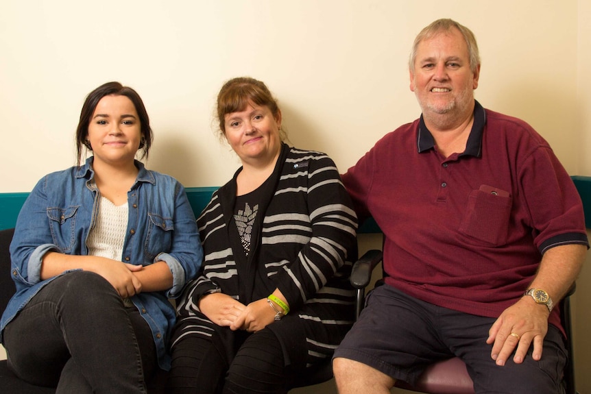 Sophia Stewart, Caroline Matthews and Tony Stewart sit in front of a plain wall.