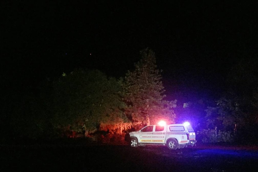 An ambulance on scene at a rural property near Gunning , NSW where the bodies of three people were found in a concrete tank.