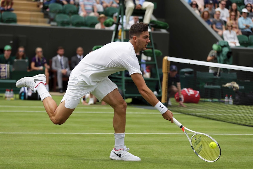 Thanasi Kokkinakis returns to Argentina's Juan Martin Del Potro during their Men's Singles Match