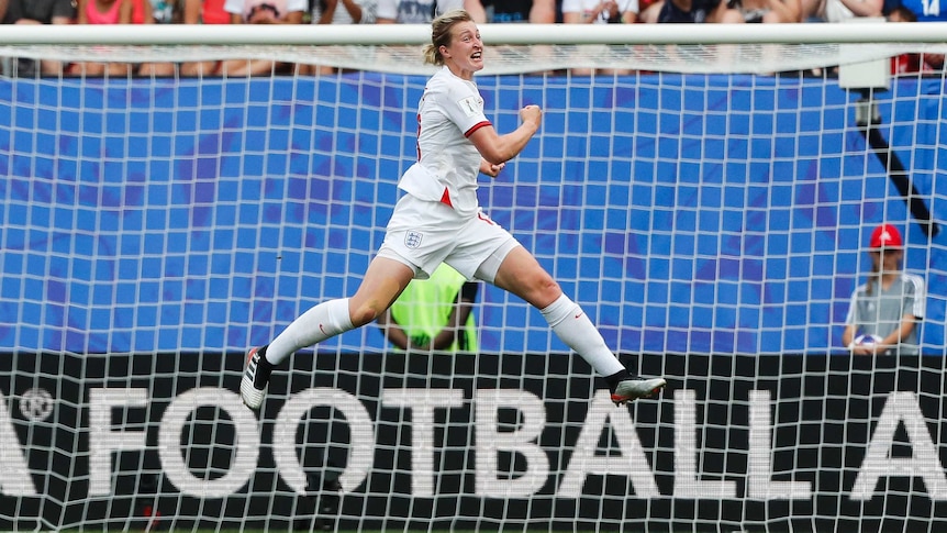 A soccer player does the splits mid-air as she celebrates her goal at the FIFA Women's World Cup.