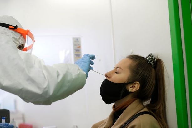 A woman undergoes the rapid antigen test for the coronavirus