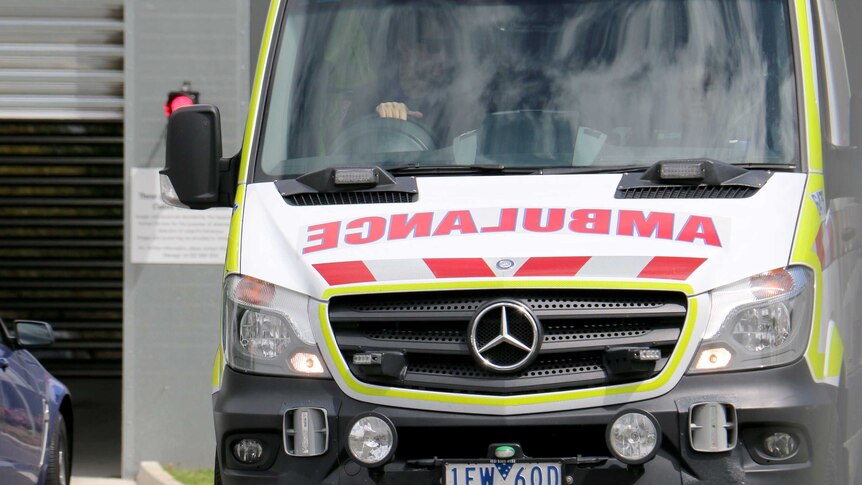 An ambulance vehicle outside a hospital