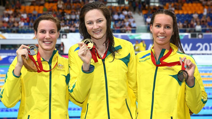 Australians Cate Campbell, Bronte Campbell (L) and Emma McKeon (R) after going 1-2-3 in the women's 100m freestyle in Glasgow