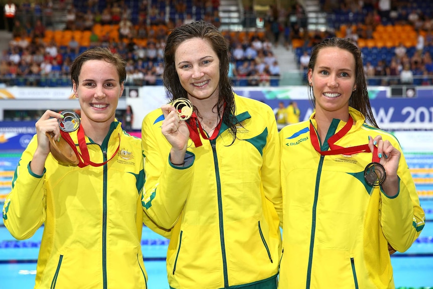 Australians Cate Campbell, Bronte Campbell (L) and Emma McKeon (R) after going 1-2-3 in the women's 100m freestyle in Glasgow