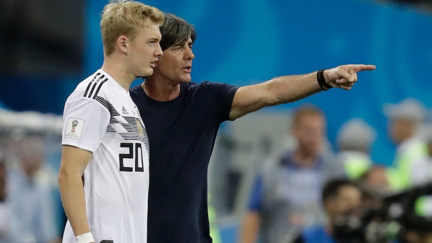 Joachim Low speaks to Julian Brandt