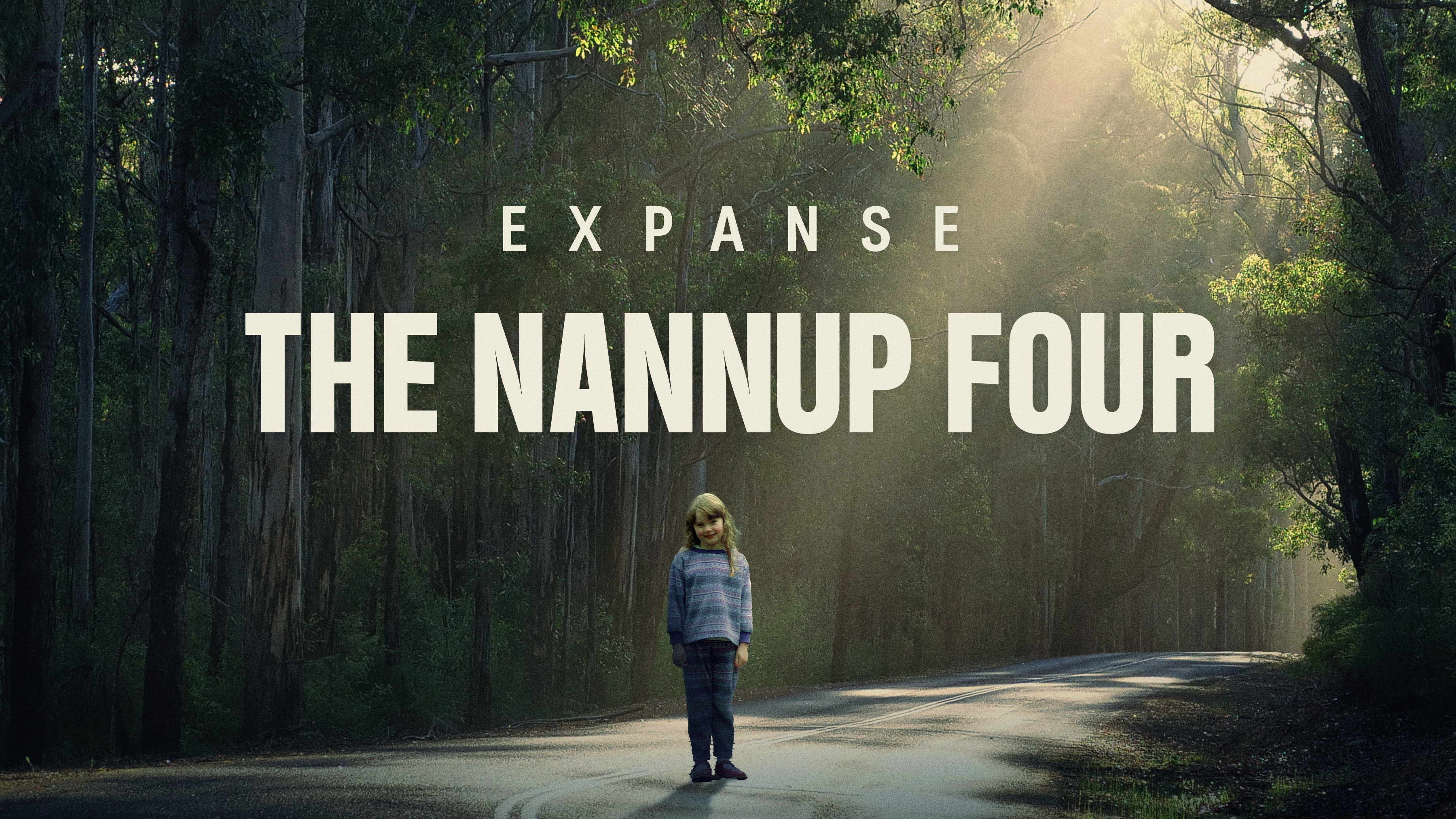 Expanse: The Nannup Four. A little girl stands in the middle of a deserted road in the woods, head tilted to one side.