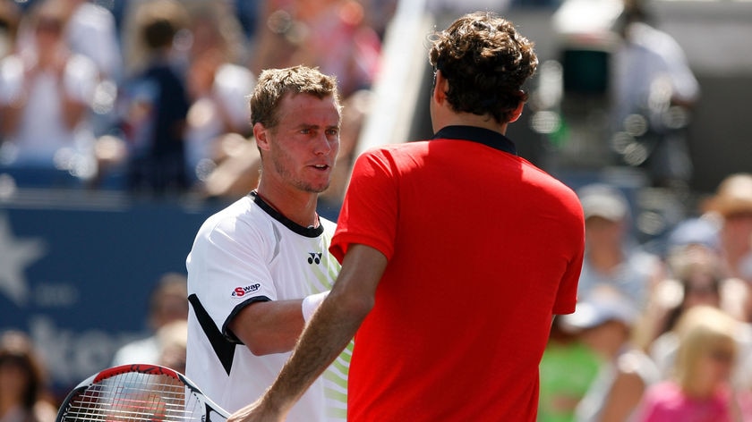 Hewitt (l) expects a tough time regardless of Roger Federer's short US Open turnaround.