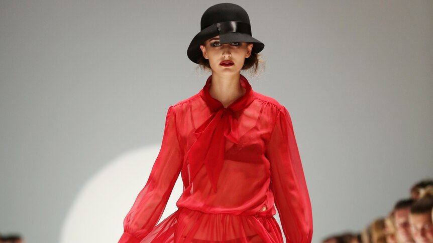 A model walks the runway at Sydney Fashion Week in a Johanna Johnson dress.