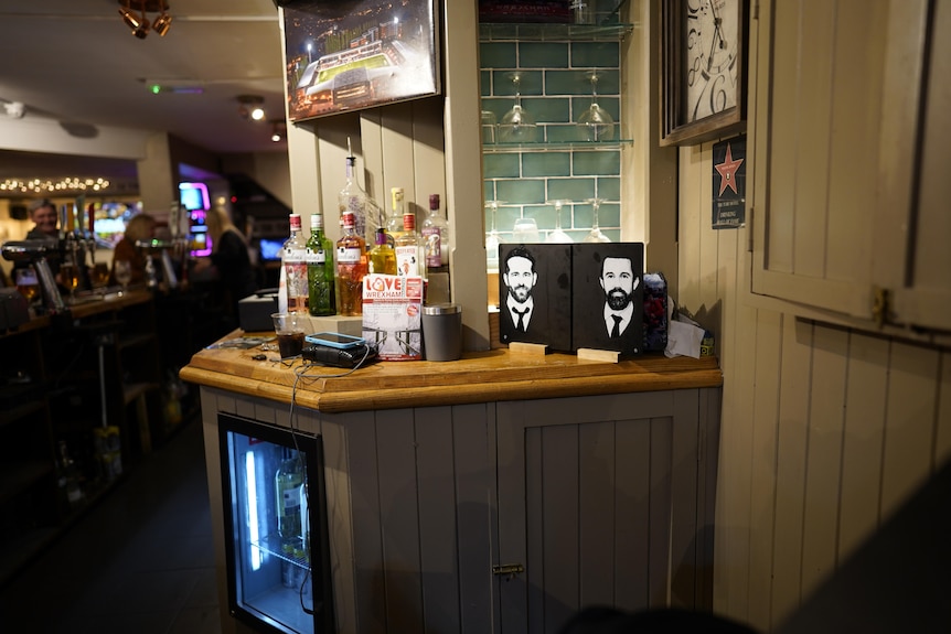 A pub with pictures of Ryan and Rob.
