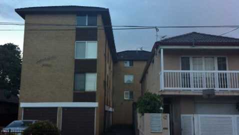 The men were shot outside this unit block in Sydney's south-east.