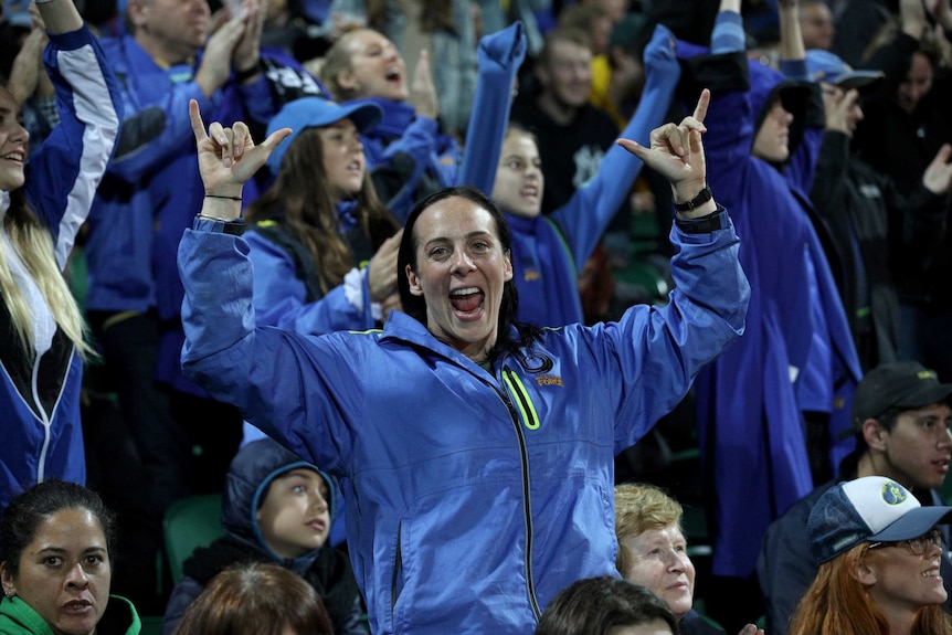 Western Force fans clad in blue celebrate their side's win over Fiji in Perth.