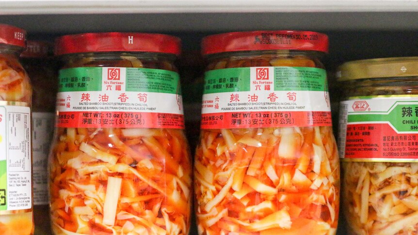 Two jars of bamboo shoots in chilli oil.