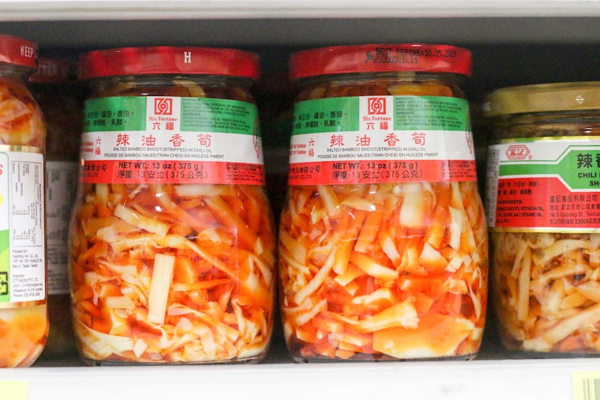 Two jars of bamboo shoots in chilli oil.